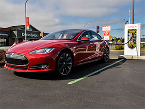 Green pavement markings at Tesla supercharging station